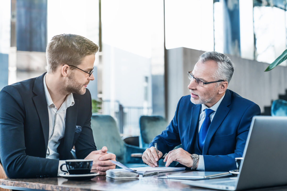 two businessmen discussing